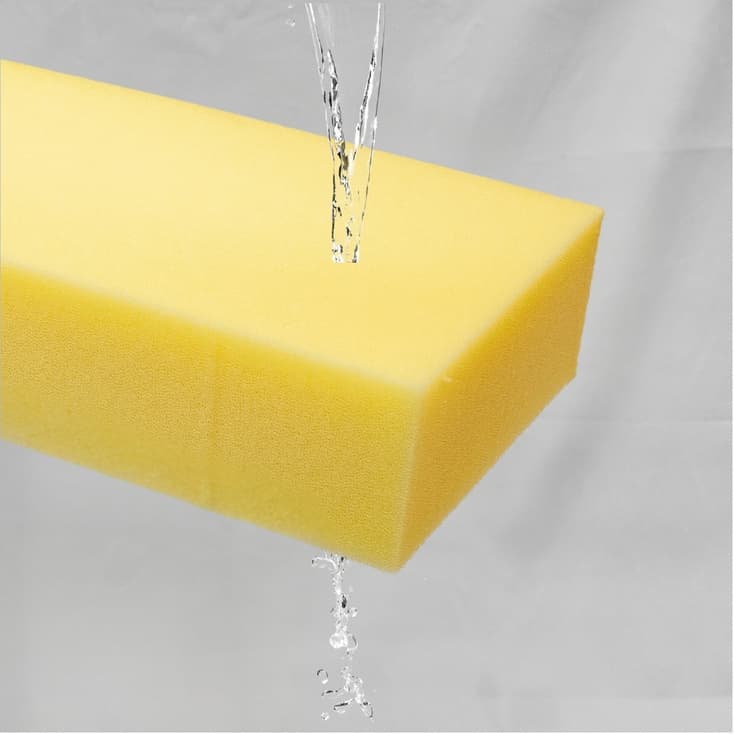 Outdoor foam with water being poured on it to show open cell structure