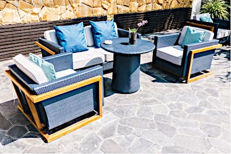 Ashely Outdoor furniture set in a backyard patio area with new replacement custom cushions