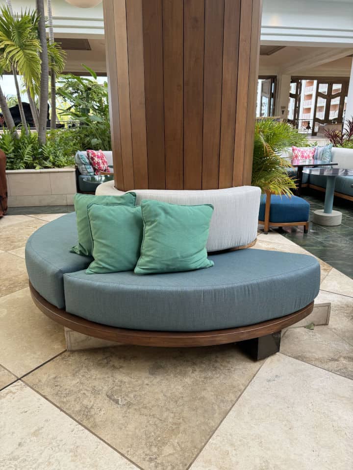 Custom-designed round seating made with spill and stain resistant Sunbrella fabric.